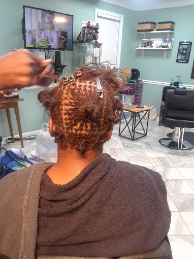 A woman getting her hair done in a salon